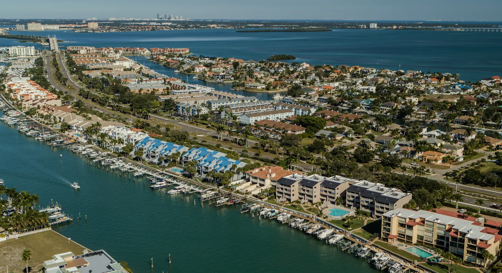 Waterfront neighborhood panorama — A finished aerial photograph connects the waterfront, homes and surrounding waterways.
